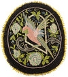 Antique embroidered parrot on perch.