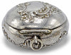 Decorative silver powder compact with swansdown puff